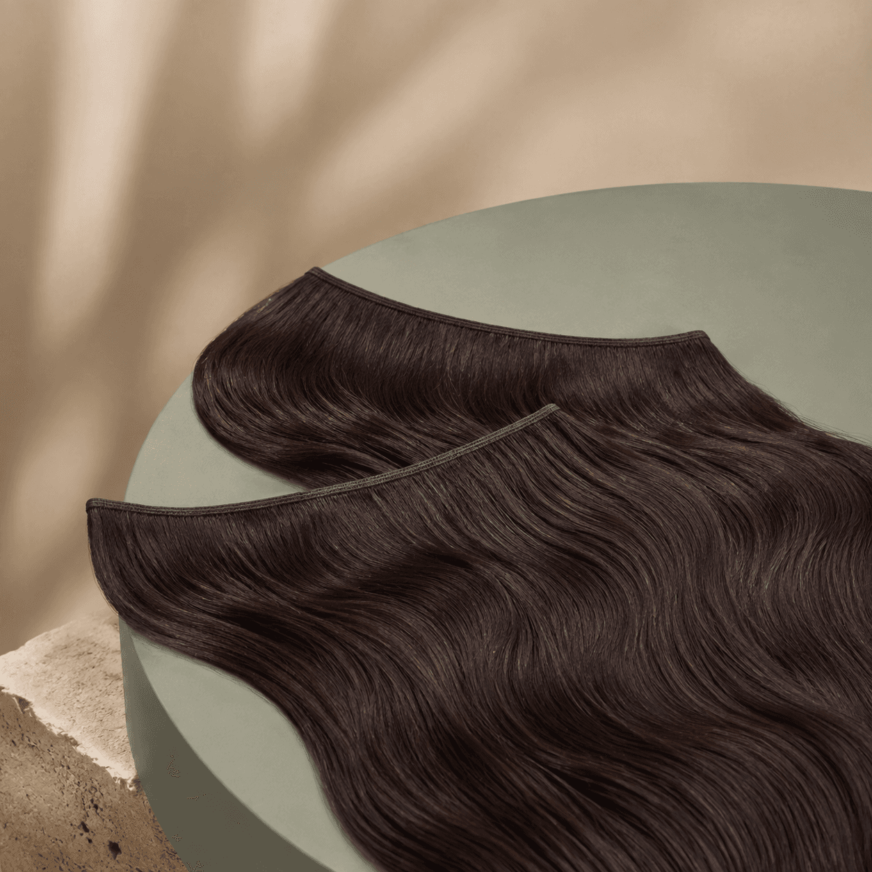 Body-wave human hair weft in dark brown